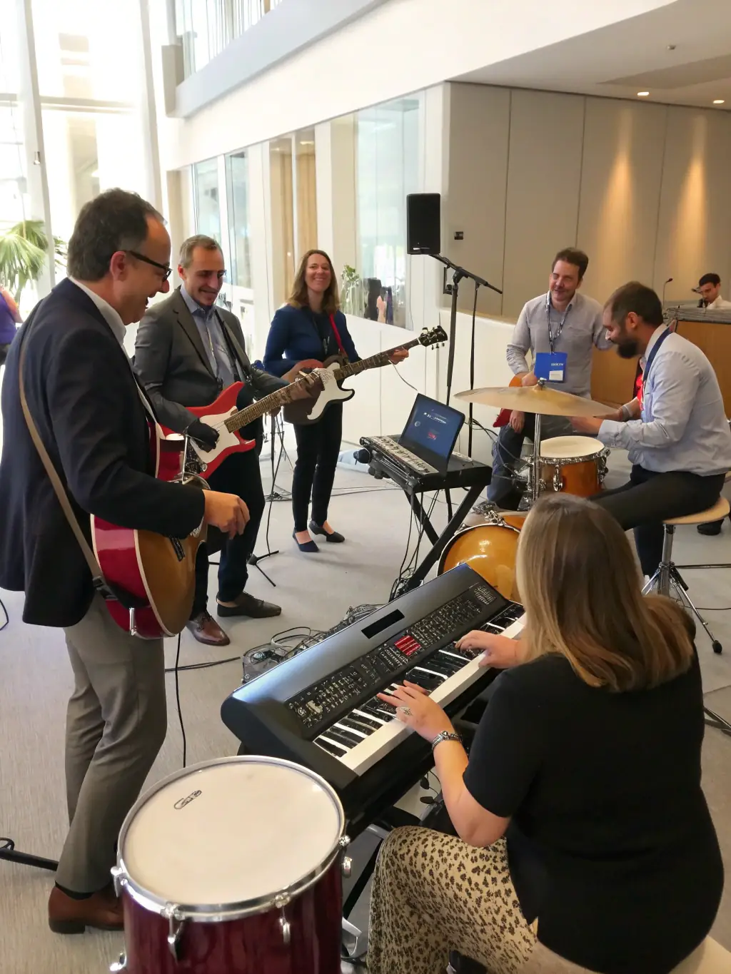 A workshop setting with artists collaborating and receiving technical guidance from QUARTIERS LIBRES staff, highlighting the organization's commitment to human assistance.